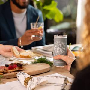 Fable Into The Woods lunch setting with couple drinking Fable